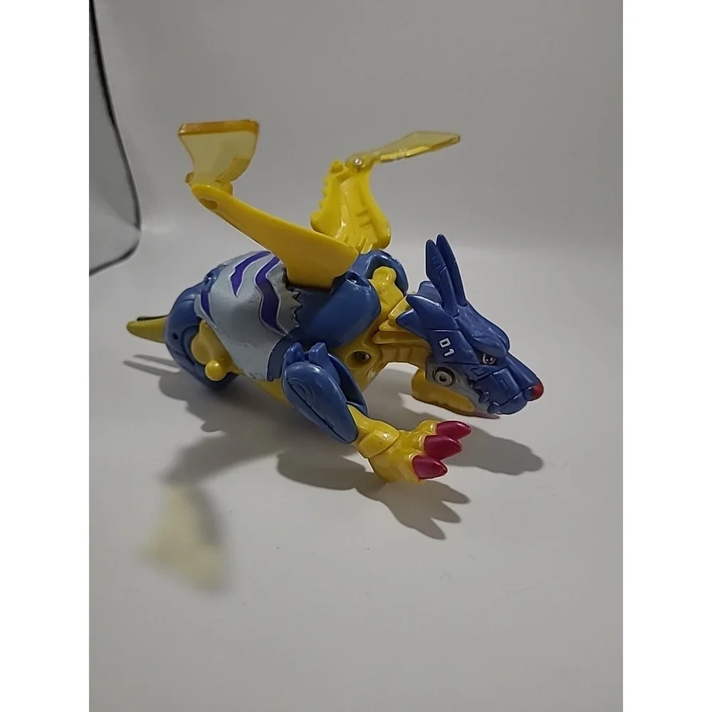 Vtg DIGIMON Digivolving Metal Garurumon digivolves to Gabumon Digimon 90%‎